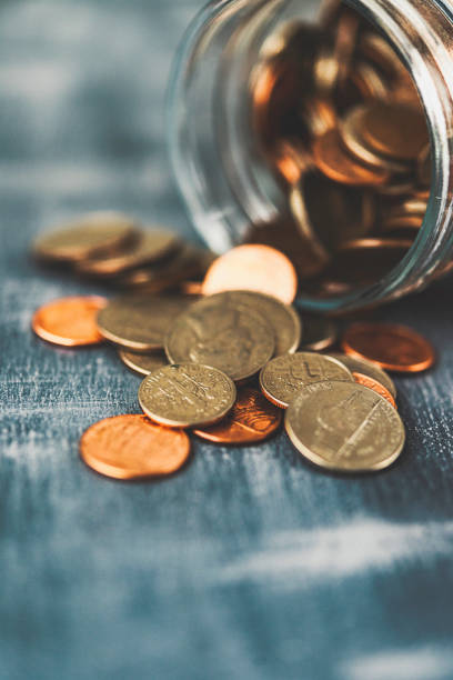 istock Money jar filled with cash for charitable cause 881319030