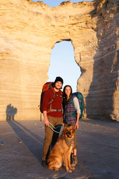 istock Couple hiking together in the wilderness 881326500