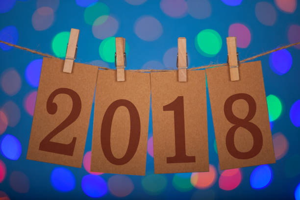 istock New Year 2018 Concept Clipped Cards and Colored Lights 881328846