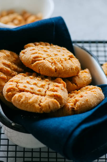 istock Homemade peanut butter cookies on a wire rack. Gray background. Rustic style. 881337116