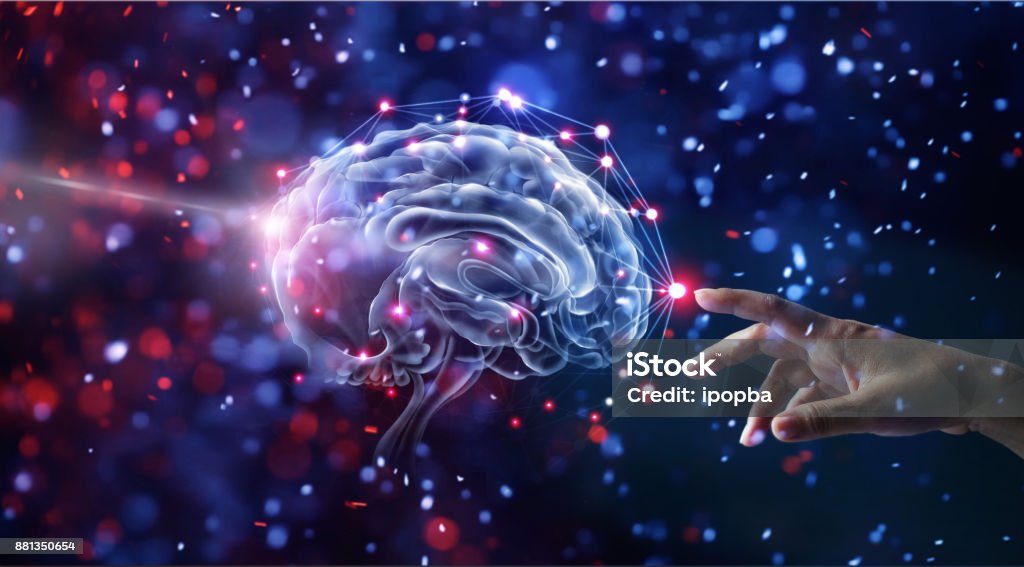 Hand touching brain and network connection on glitter bright lights colorful  background Intelligence Stock Photo