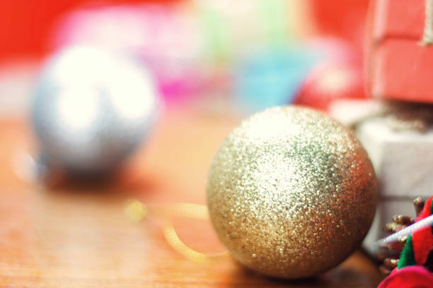 istock Golden balls on wooden. 881350946