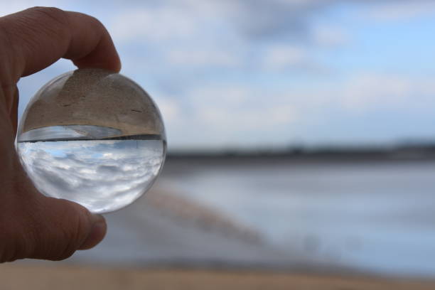 istock A hand holds a crystal ball 881361924