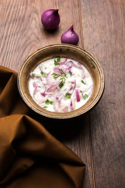 Onion Raita / pyaj or kanda Koshimbir / Indian salad is a condiment from the Indian subcontinent, made with dahi or curd together with raw or cooked vegetables like onion, tomato, green chilli and coriander
