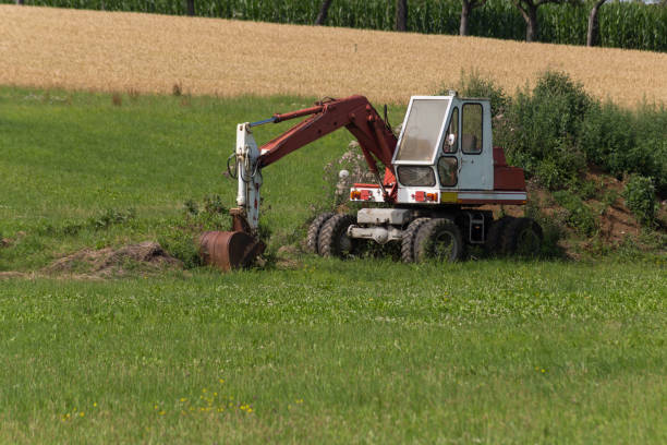 istock digger with hut and earth on a corn field rural landscape 881387300
