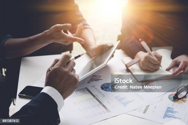 Group Of Business People Busy Discussing Financial Matter During Meeting Corporate Organization Meeting Concept With Vintage Tone Stock Photo - Download Image Now