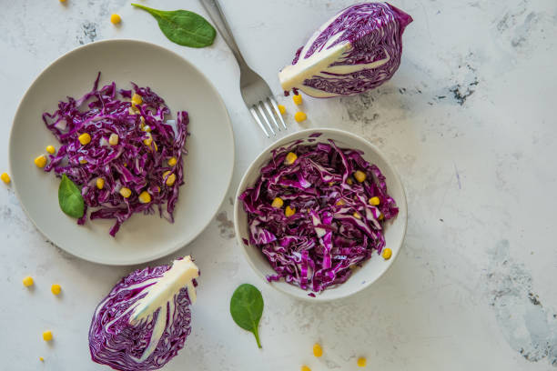 istock Fresh red cabbage salad with corn. Vegeterian and diet food, top view 881415184