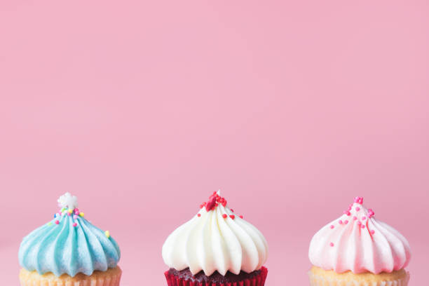 istock Pastel tone tree cupcakes on pink copy space for part text 881415248