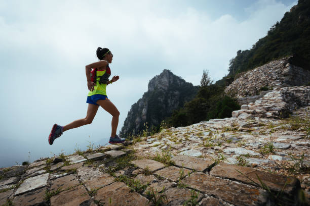istock young woman trail runner running on the great wall 881415690