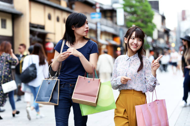 istock Walking with a friend around a busy street 881421342