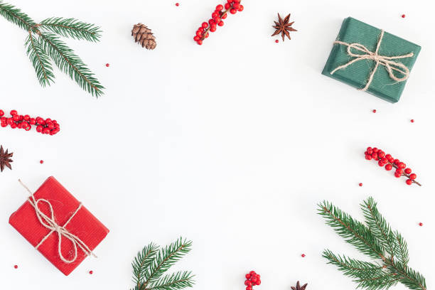 istock Christmas gifts, fir tree branches. Flat lay, top view 881424542