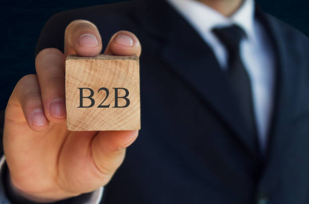 istock Man showing wooden cube with a written B2B word. 881424660