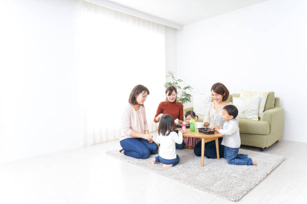 istock Mothers' friends and children doing party 881424832