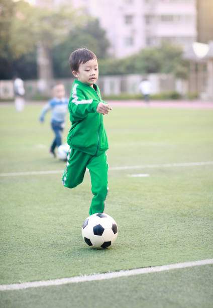 istock Boy with soccer ball 881429724