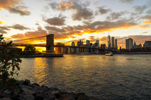 istock New York Skyline with Brooklyn Bridge Hudson River Manhatten Sun 881433862