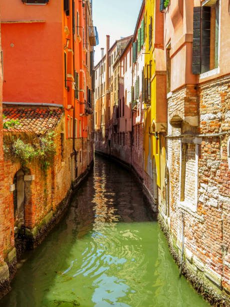 istock Venice - View from water street to old buildings 881443280