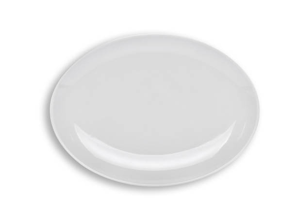 istock top view of empty white plate isolated on white background 881459772