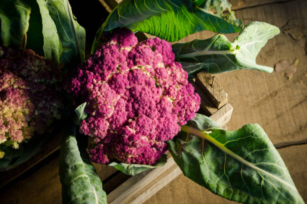 istock Beautiful cauliflower in the wooden crate 881461050