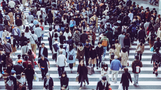 istock Asian People are across the crosswalk 881464006