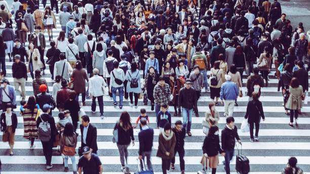 istock Asian People are across the crosswalk 881464076