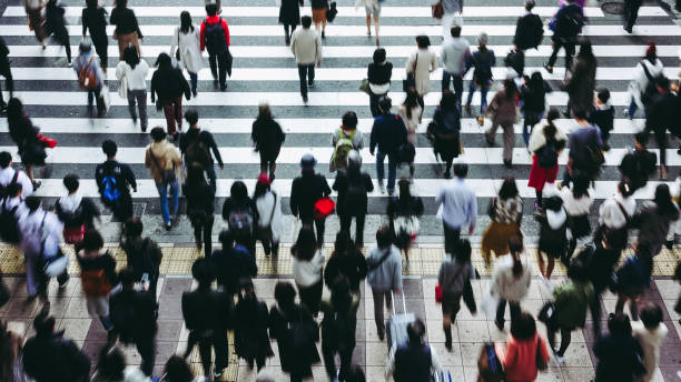 istock Asian People are across the crosswalk 881464240