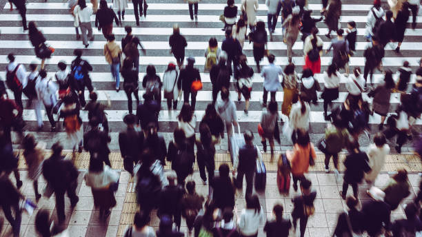 istock Asian People are across the crosswalk 881464268