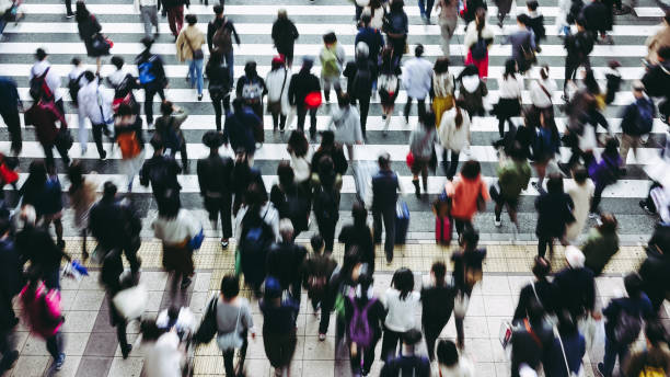 istock Asian People are across the crosswalk 881464292