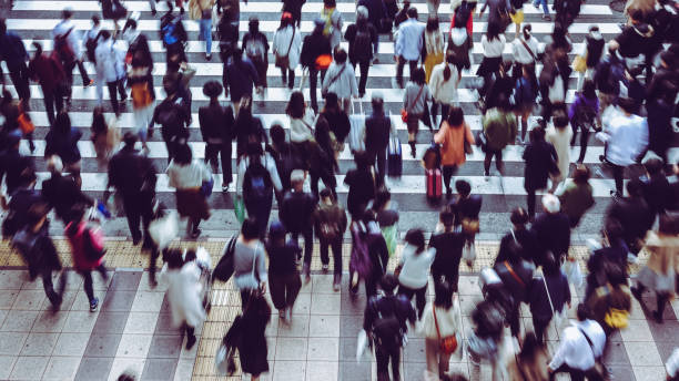 istock Asian People are across the crosswalk 881464320
