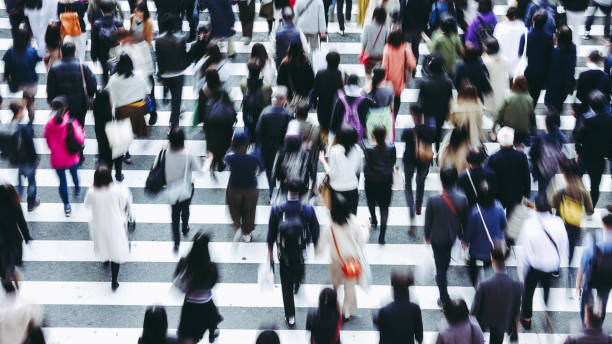 istock Asian People are across the crosswalk 881464360