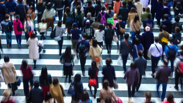 istock Asian People are across the crosswalk 881464416