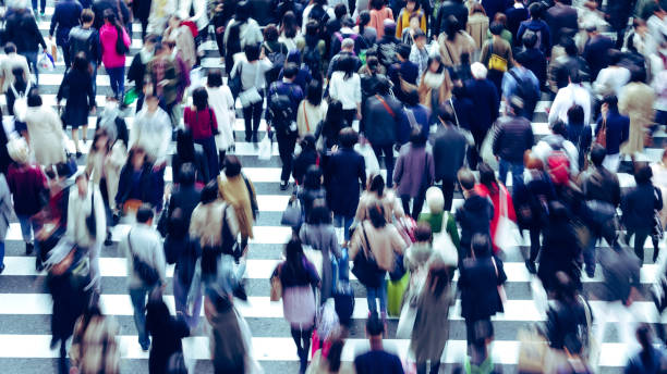 istock Asian People are across the crosswalk 881464480