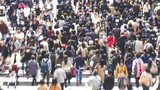 istock Asian People are across the crosswalk 881464538