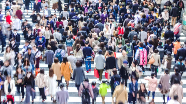 istock Asian People are across the crosswalk 881464612