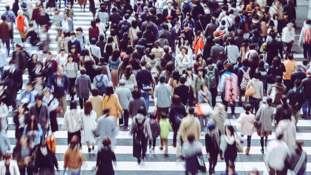 istock Asian People are across the crosswalk 881466018