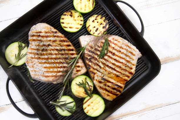 istock Grilled swordfish with rosemary and courgettes 881467786
