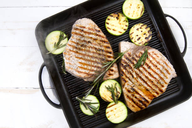 istock Grilled swordfish with rosemary and courgettes 881467844