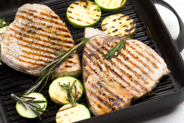 grilled swordfish with rosemary and courgettes - swordfish imagens e fotografias de stock