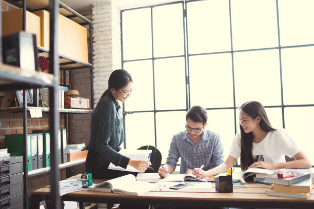 istock Asian groups are brainstorming, working in the office, reviewing lessons, doing homework in the university, group concept. 881470232