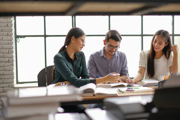 istock Asian groups are brainstorming, working in the office, reviewing lessons, doing homework in the university, group concept. 881470454