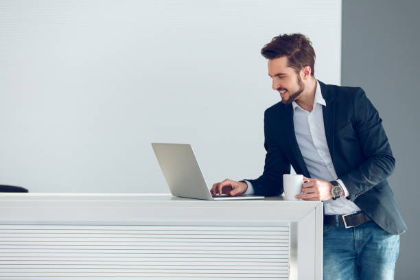 istock Young businessman using laptop looking for new ideas. 881470656