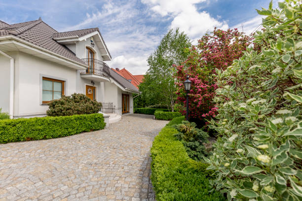 istock Driveway to mansion with garden 881475254