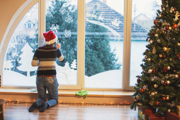 istock Christmas on a window glass 881477630
