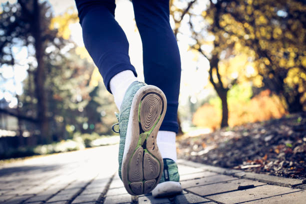 istock Mans feet running. Close up. 881484406