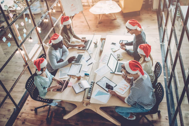 istock Celebrating Christmas in office. 881484888