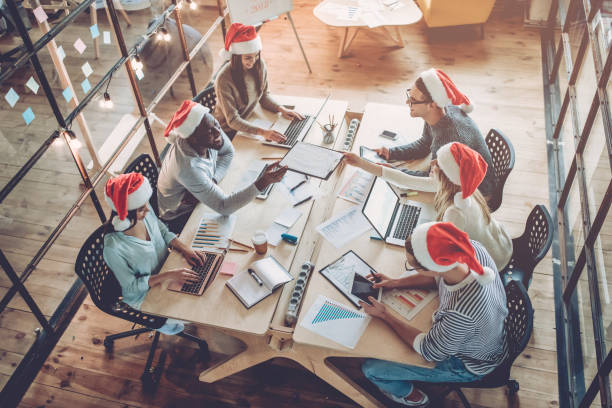 istock Celebrating Christmas in office. 881484898
