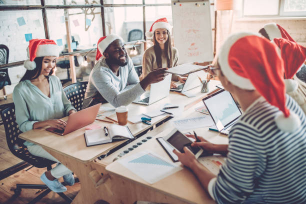 istock Celebrating Christmas in office. 881484904