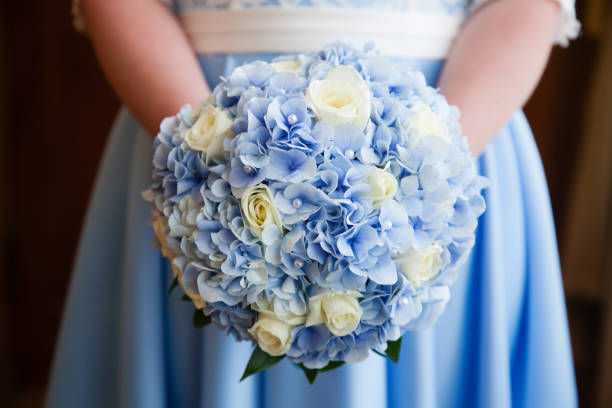 Beautiful wedding bouquet of flowers in bride’s hands