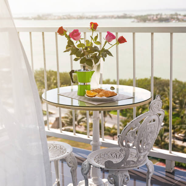 istock Breakfast with coffee on terrace decorated with flowers 881488368