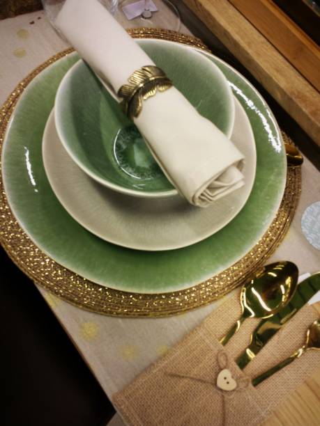 istock Christmas table setting in green and gold 881488388