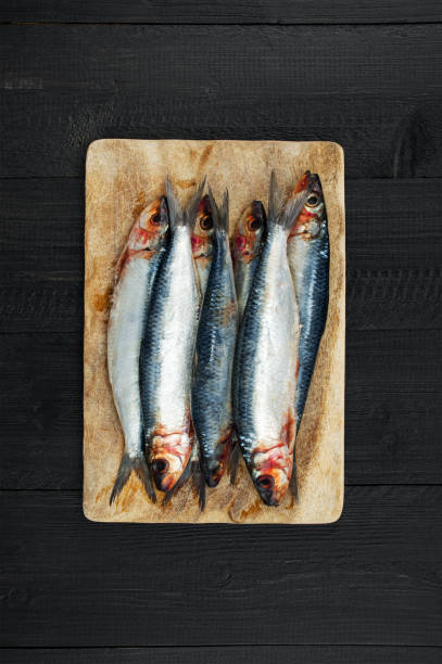 istock Raw fresh sardines and on the dark table 881492972
